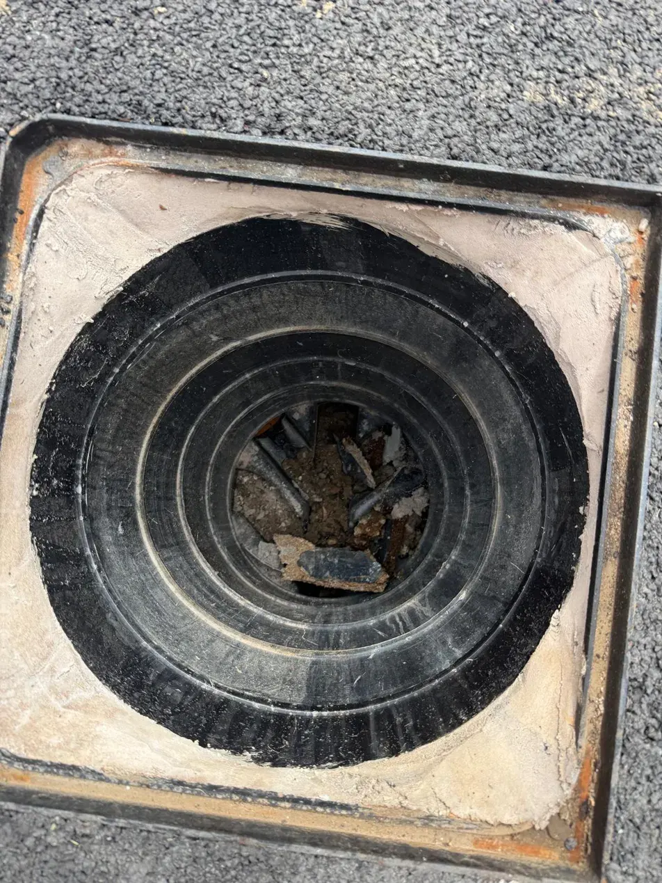 Blocked gully cleared of builder's debris in Northampton